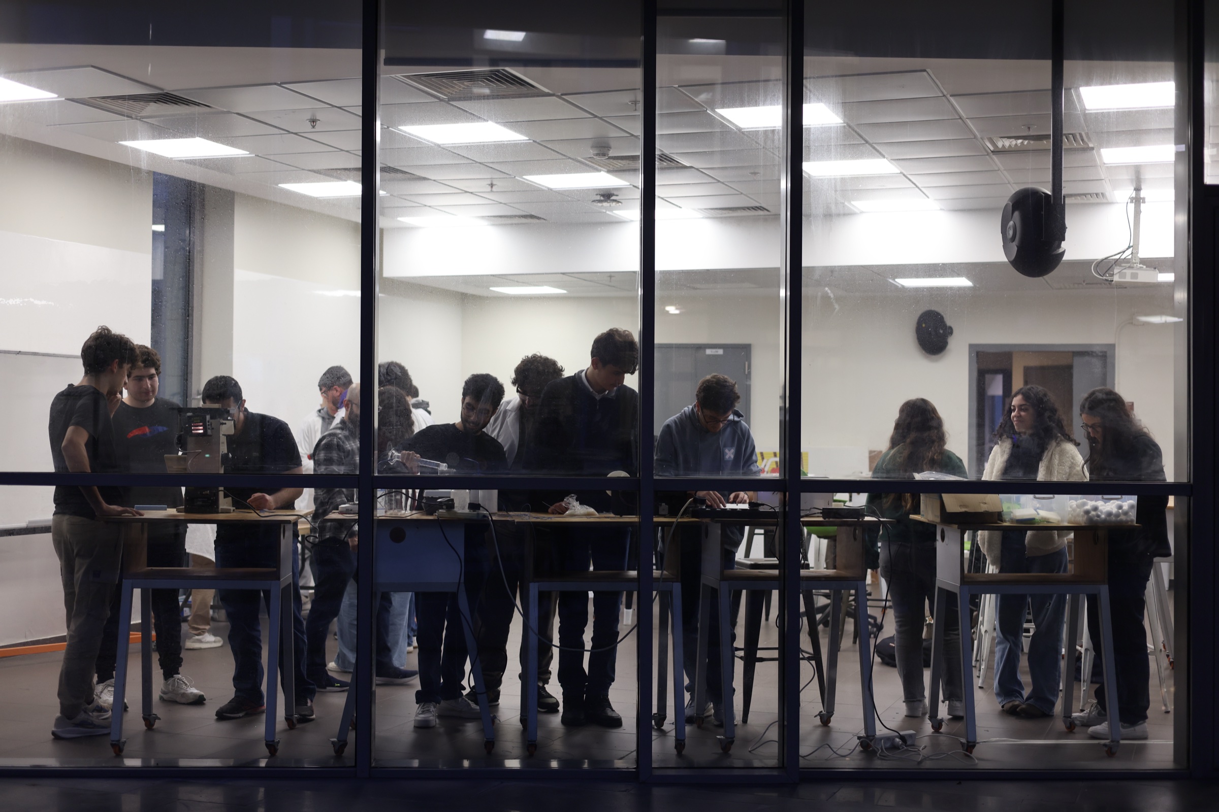 MSFEA students listening and exchanging ideas with an instructor during an active learning session.